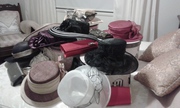 variety of hats and clutch bags